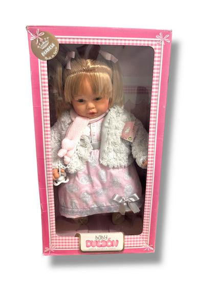 Muñecas Berbesa Baby Dulzón, a soft, cuddly baby doll by Spielzeug & Spielwaren, dressed in a cute outfit.