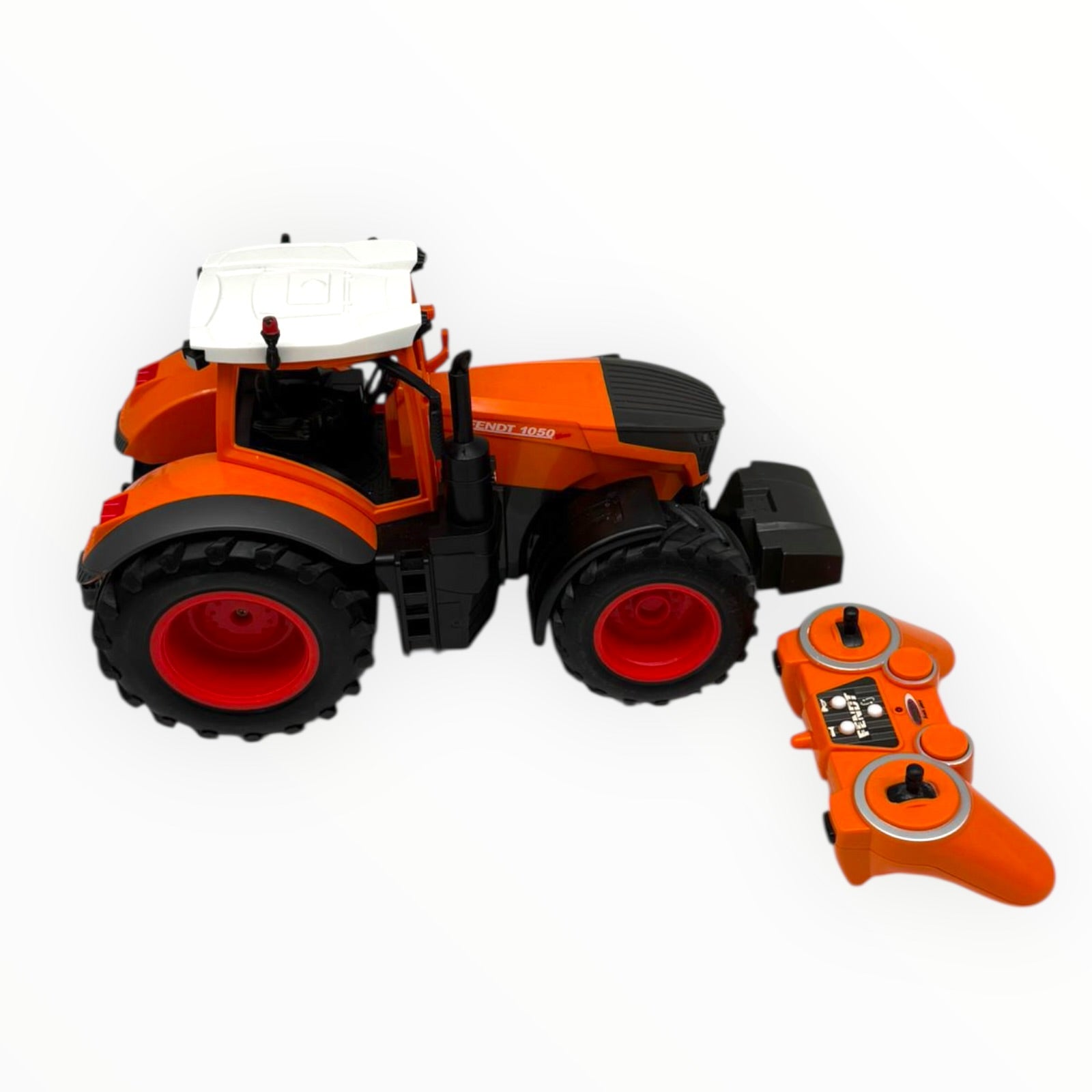 Orange JAMARA Fendt 1050 Vario Kommunal RC tractor model in 1:16 scale, showcasing detailed design and features.