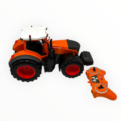 Orange JAMARA Fendt 1050 Vario Kommunal RC tractor model in 1:16 scale, showcasing detailed design and features.